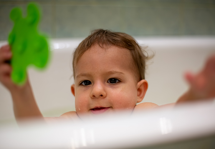 boy taking bath with water from tankless water heater forest virginia